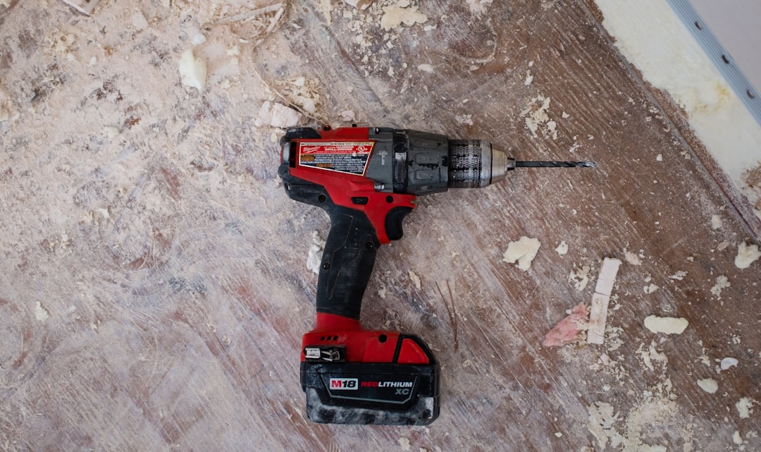 18V cordless hammer drill kit with 2 batteries on a workbench