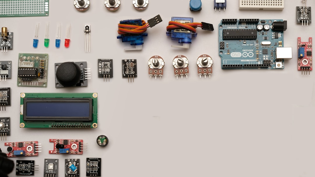 Soldering iron on a workbench with electronics components