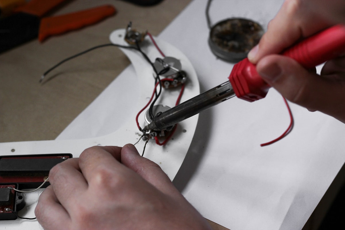 Soldering station on a workshop bench with electronics