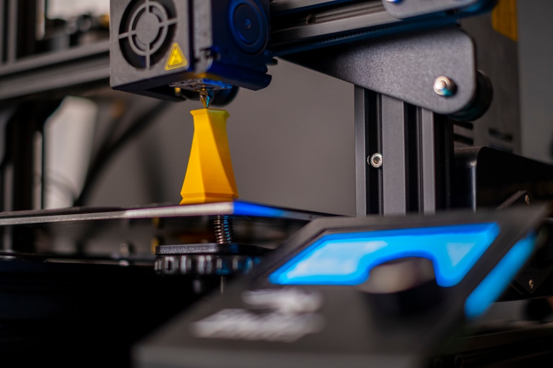 3D printer with filament spool printing a part