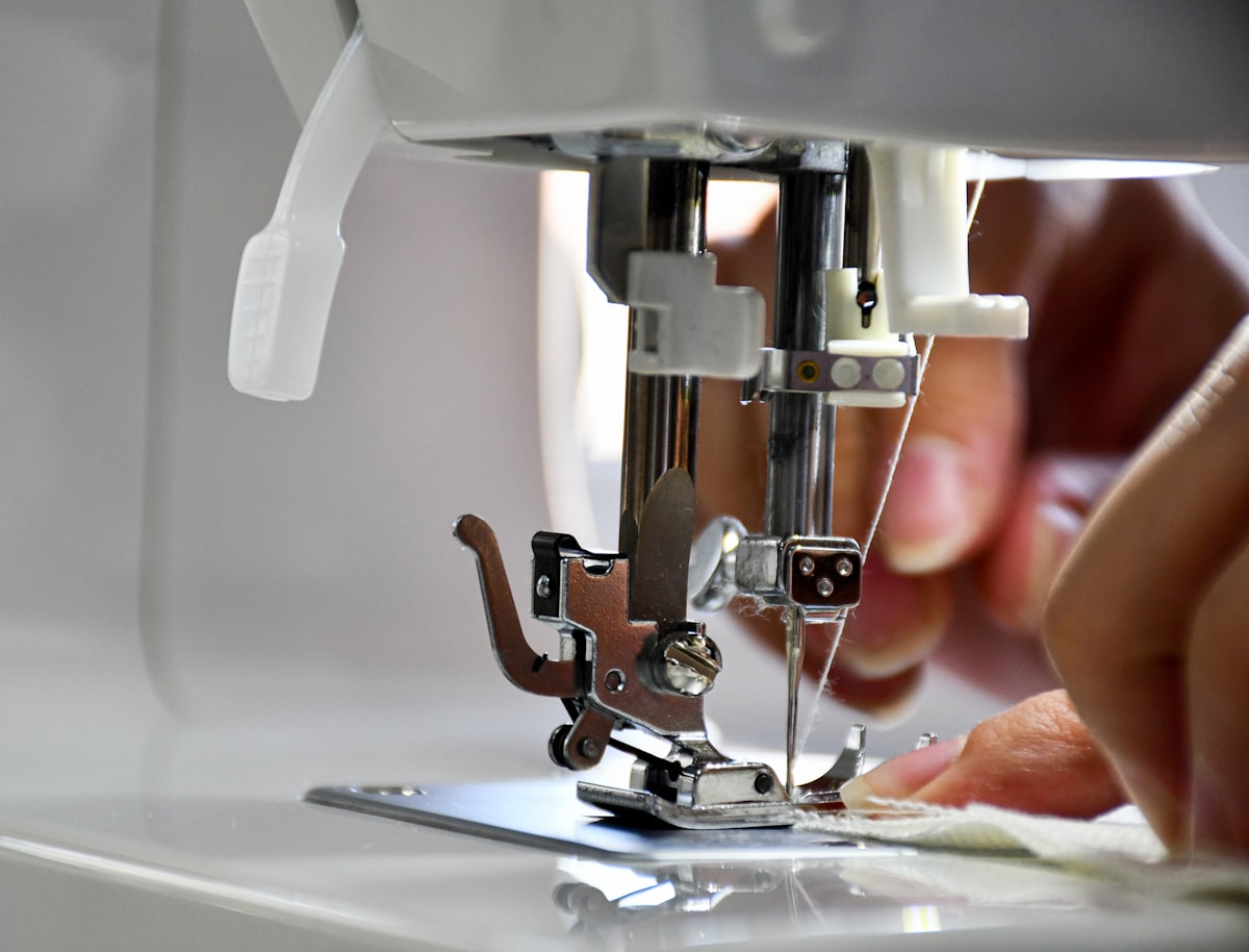 Hand stitching leather craft with sewing tools on a workbench