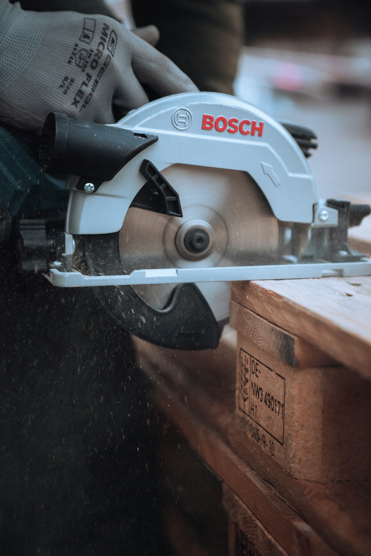 A mitre saw and circular saw on a workshop workbench